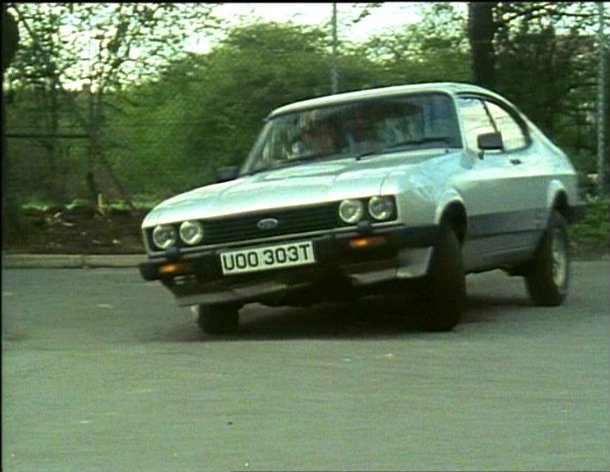 A picture of the car from the TV show The Professionals cornering aggressively. This type of security driving is usually covered during bodyguard training. 